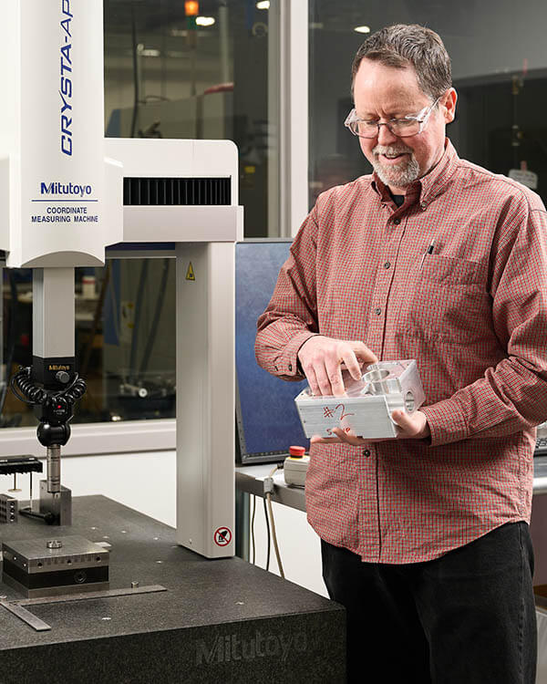 PATH MACHINING AND AUTOMATION engineer works on 5 axis cnc machine